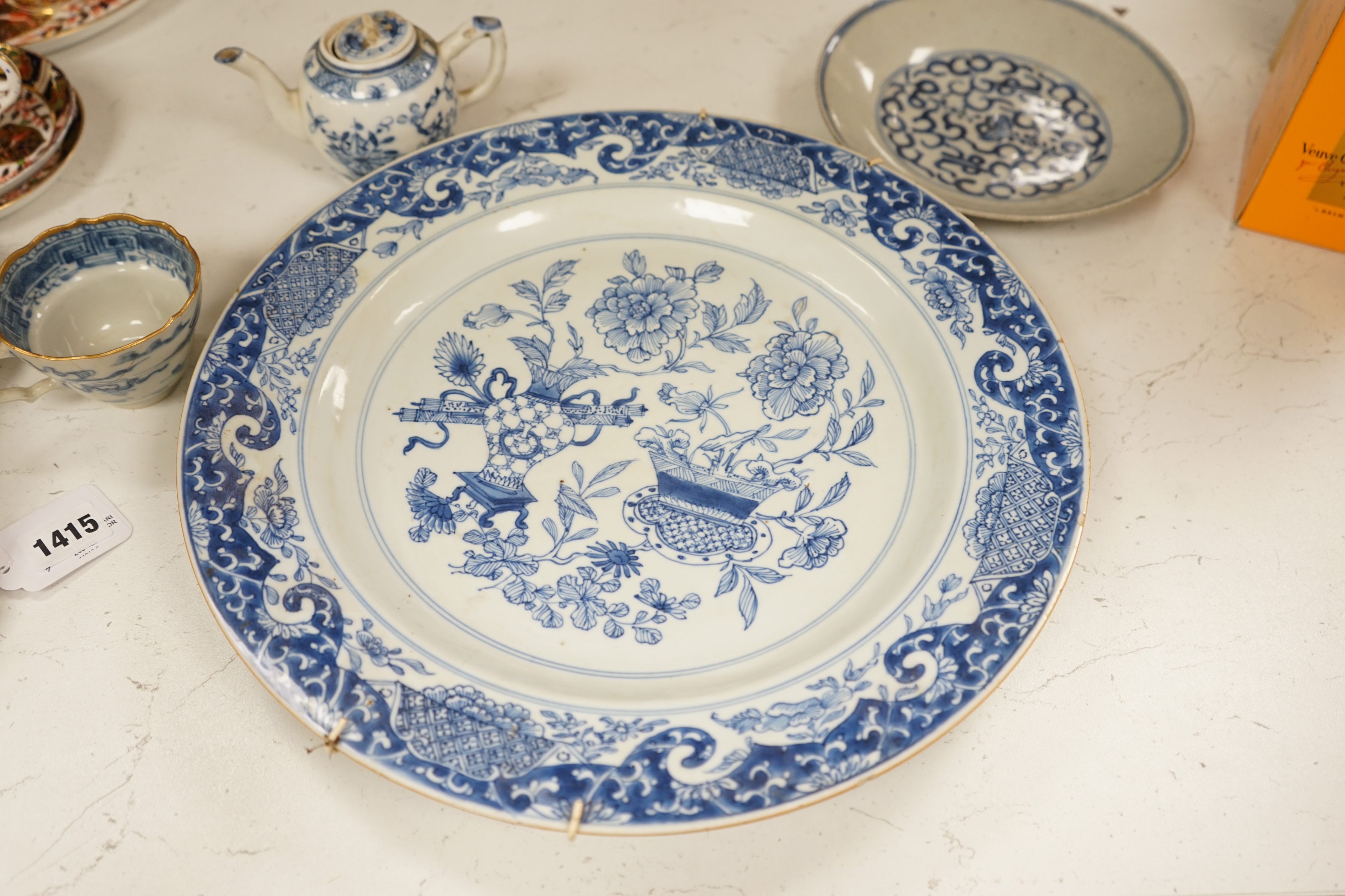 A Worcester teapot, c.1770, two 18th century Chinese porcelain dishes, a cup and saucer, a Chinese shallow bowl and a small teapot, largest dish 39cm